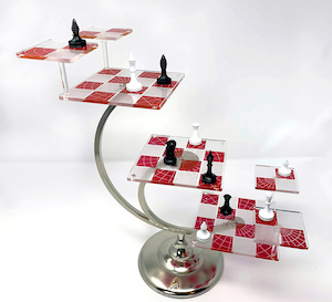Multi-level 3D chess set with black and white chess pieces on red and white boards.